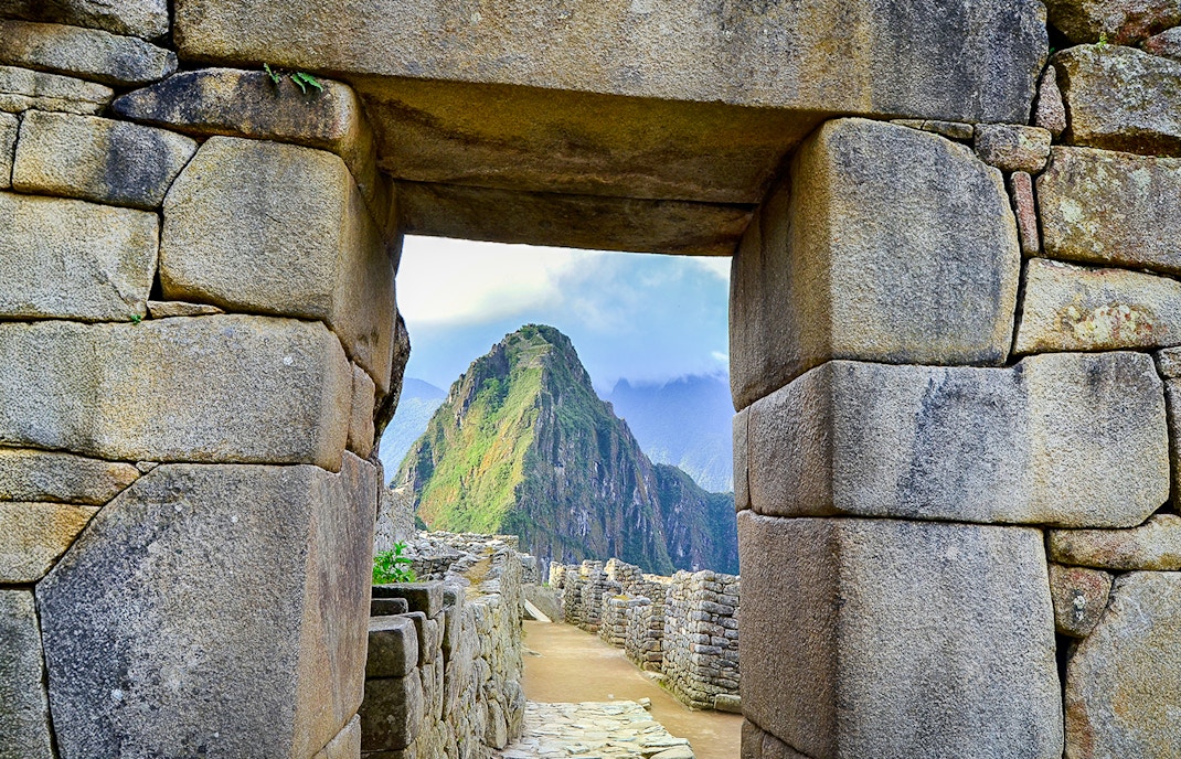 Main entrance doorway at Machu Picchu with Huayna Picchu in the background.