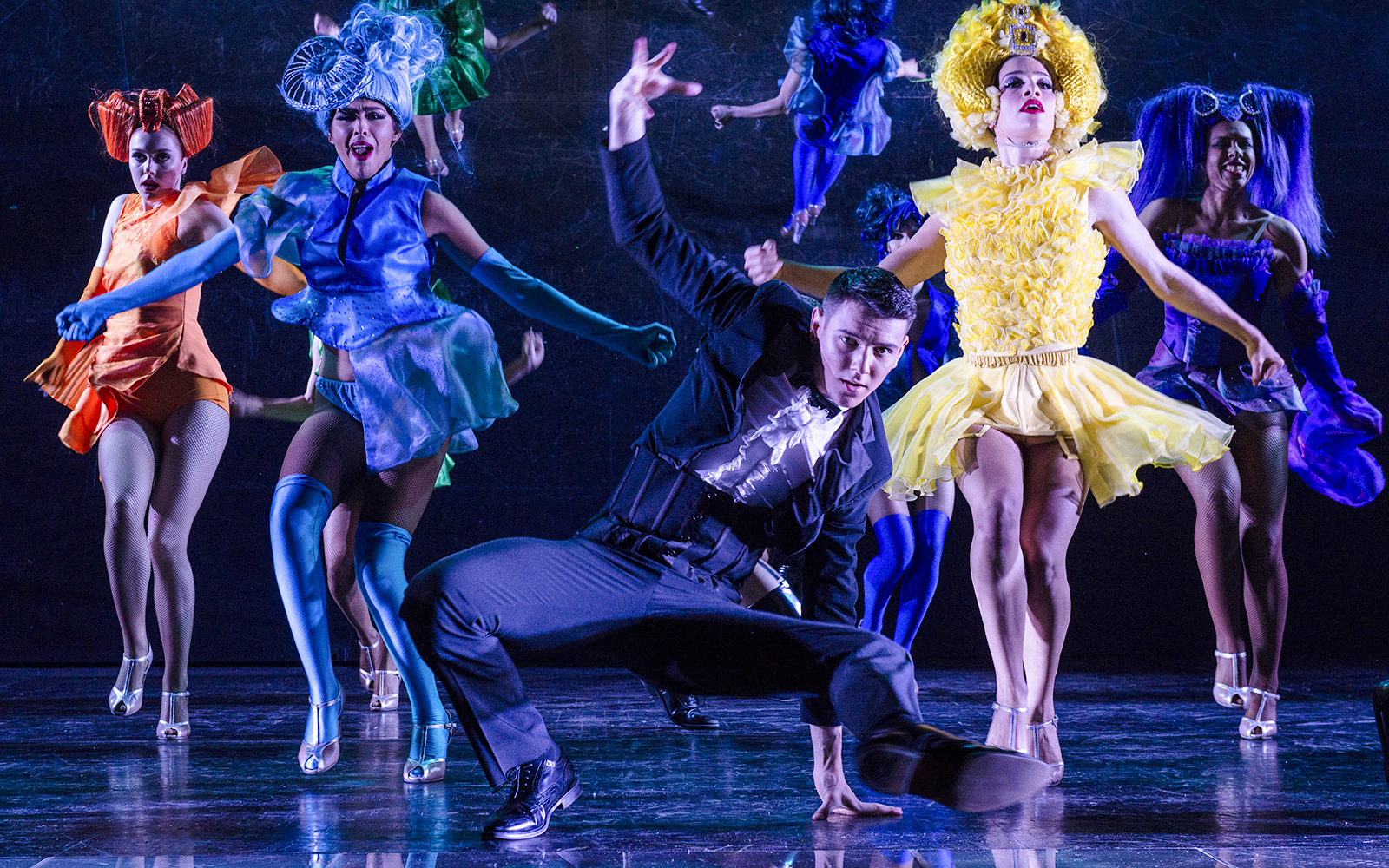 Dancers performing at a festive show in Paradis Latin, Paris.