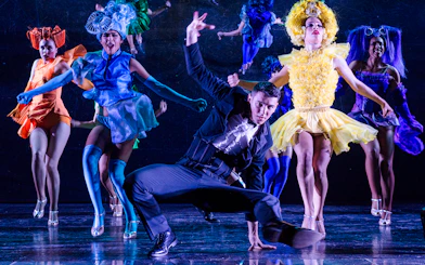 Dancers performing at a festive show in Paradis Latin, Paris.