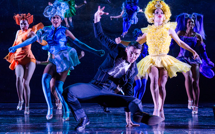 Dancers performing at a festive show in Paradis Latin, Paris.