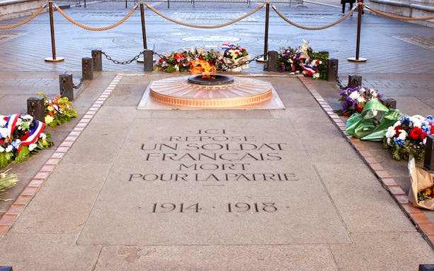 Tomb of the Unknown Soldier with eternal flame at Arc de Triomphe, Paris.