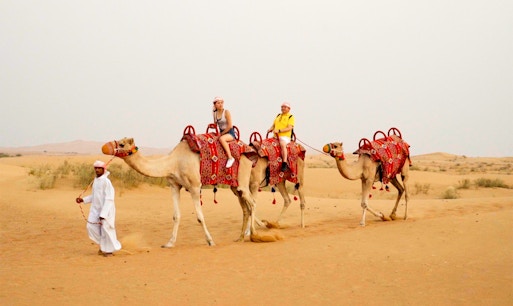 Camel ride during a morning desert safari in Dubai