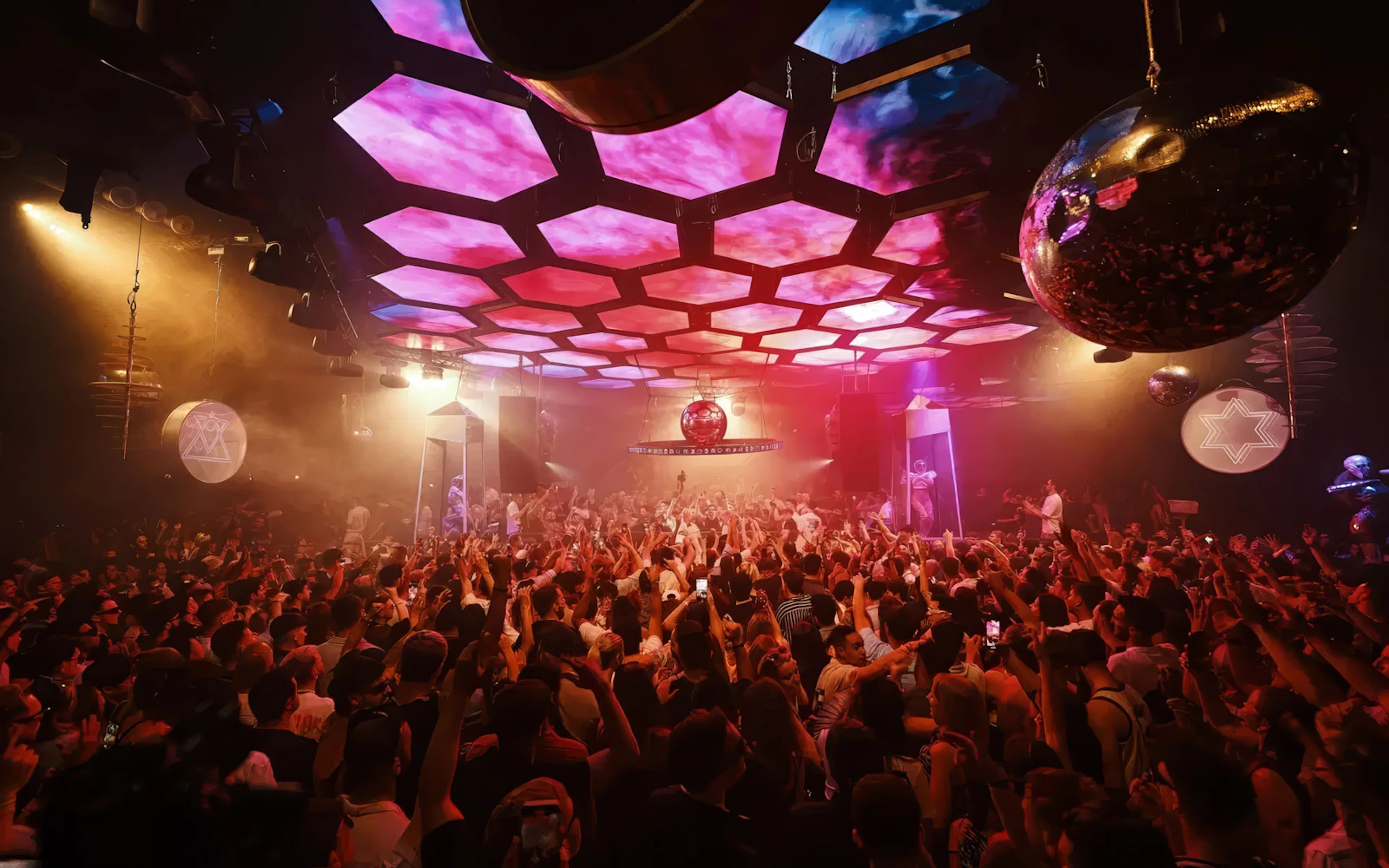 DJ performing at Music On event, Pacha Ibiza nightclub, with vibrant crowd and lighting.