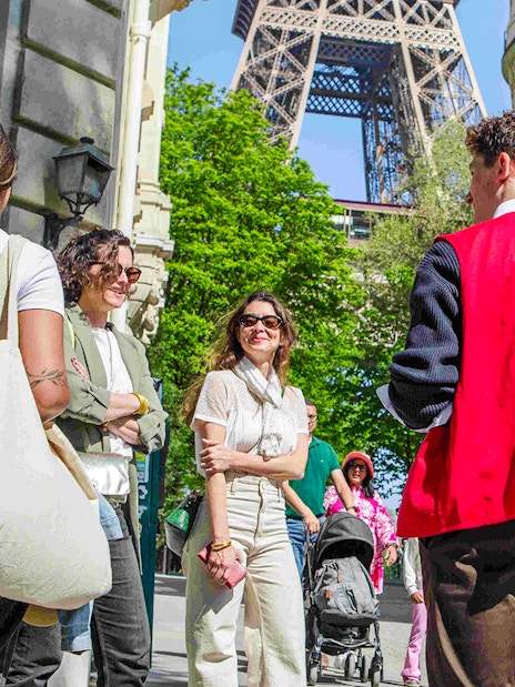 Group with guide on Paris Illumination Tour near Eiffel Tower.
