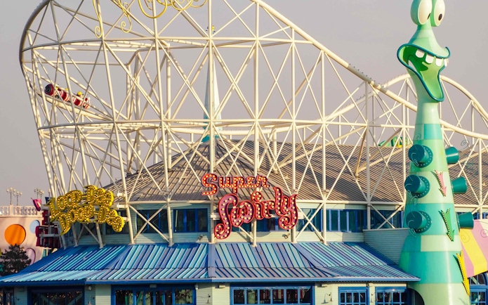 Roller coaster and whimsical architecture at Universal Studios Beijing.