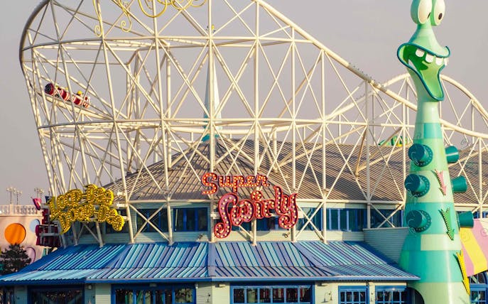 Roller coaster and whimsical architecture at Universal Studios Beijing.