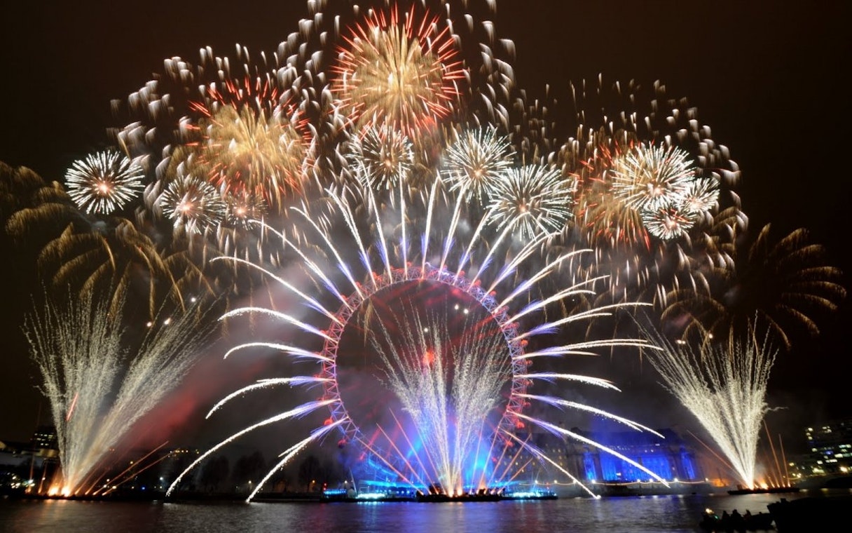 New Year's Eve fireworks over the London Eye on the River Thames.