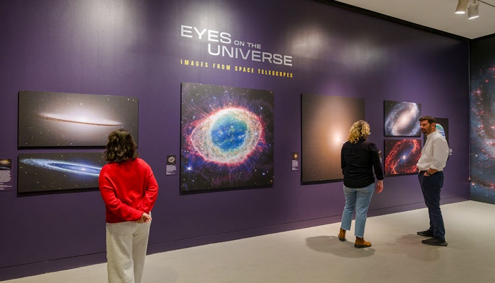 Visitors exploring the Eyes on the Universe exhibit at the American Museum of Natural History.