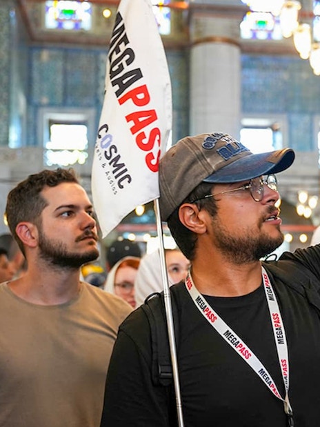 Guests with a guide inside the Blue Mosque, Istanbul, observing architecture.