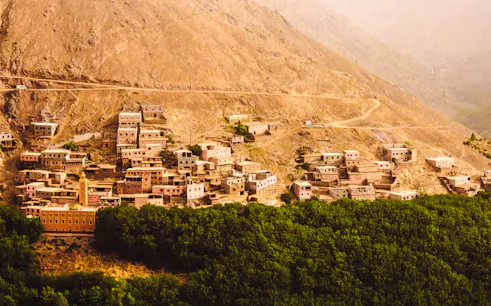 Village nestled in the Atlas Mountains near Amizmiz, Marrakesh, seen during a summit hike.