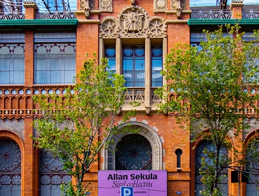 Fundació Antoni Tàpies entrance with decorative facade and exhibition sign in Barcelona.