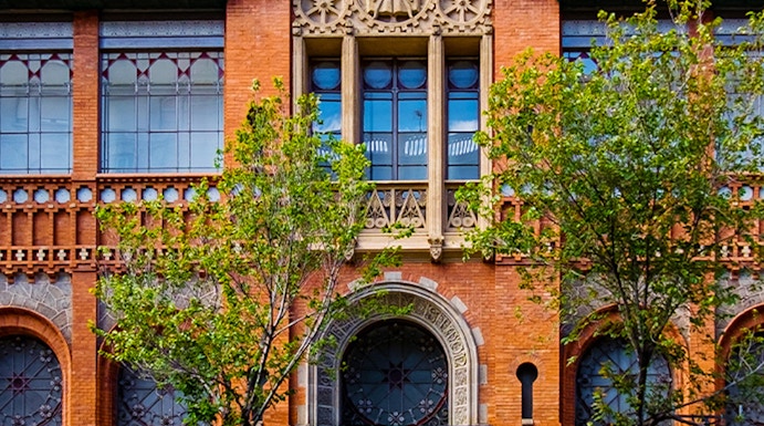 Fundació Antoni Tàpies entrance with decorative facade and exhibition sign in Barcelona.