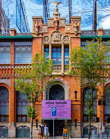 Fundació Antoni Tàpies entrance with decorative facade and exhibition sign in Barcelona.