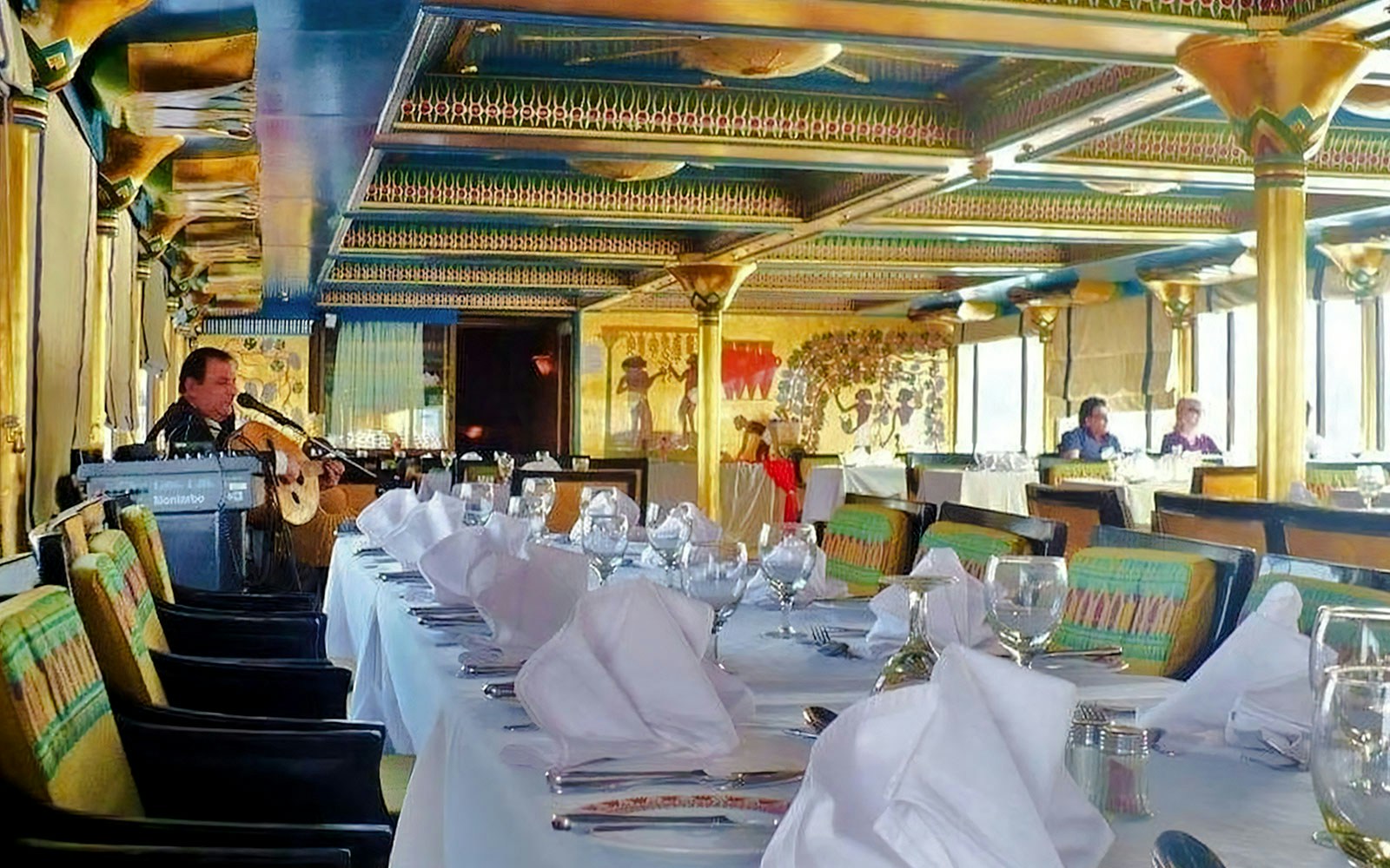 Elegant dining setup on a Nile dinner cruise in Cairo with live music.