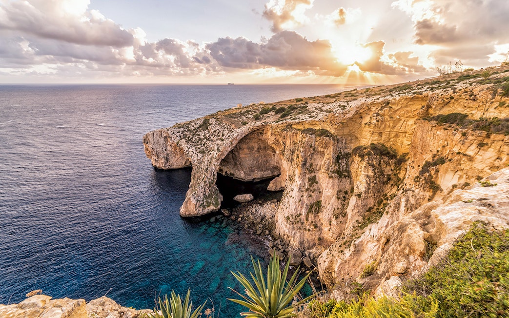 Cliffs and sea view at Blue Grotto, Malta, during sunset on the Prehistoric Temples & Highlights tour.