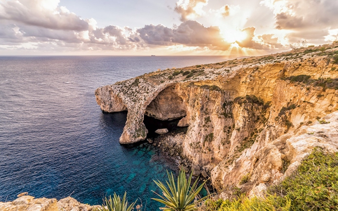 Cliffs and sea view at Blue Grotto, Malta, during sunset on the Prehistoric Temples & Highlights tour.