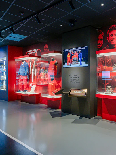 Rafa Nadal Museum interior with tennis memorabilia and display cases.