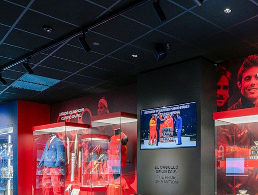 Rafa Nadal Museum interior with tennis memorabilia and display cases.