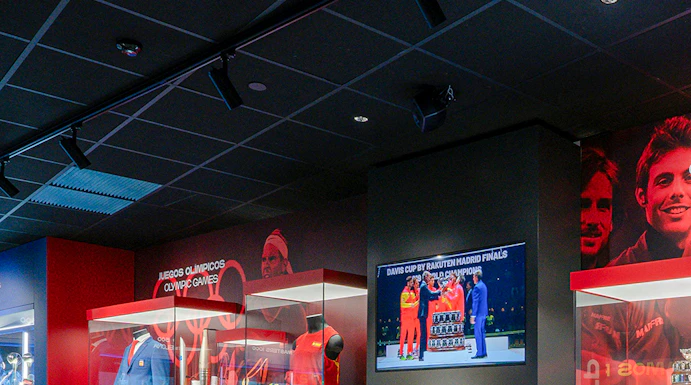 Rafa Nadal Museum interior with tennis memorabilia and display cases.