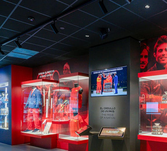 Rafa Nadal Museum interior with tennis memorabilia and display cases.