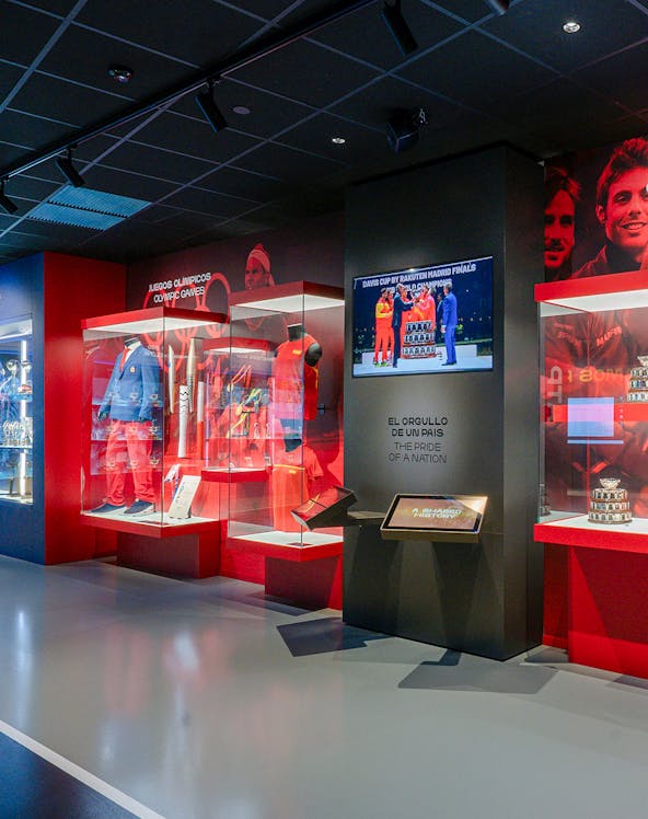 Rafa Nadal Museum interior with tennis memorabilia and display cases.