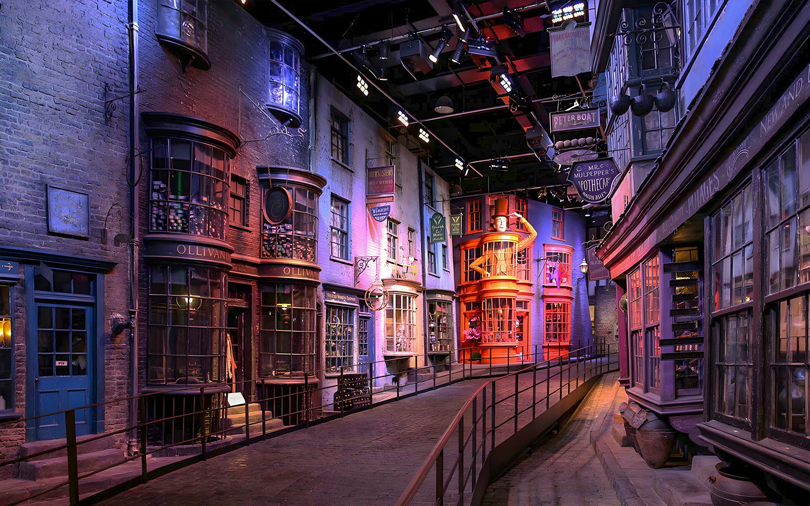 Diagon Alley at Harry Potter Exhibit, featuring cobblestone street and shopfronts, London.