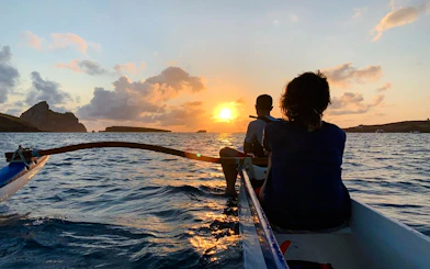 Boat ride at sunset near Noronha, with passengers enjoying the view, Sao Paulo.
