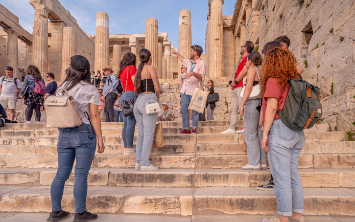 Tour group with guide at Acropolis entrance, Athens, during private English tour.