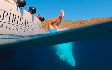 Guests diving into the sea during Santorini Joy Daytime Catamaran Cruise.