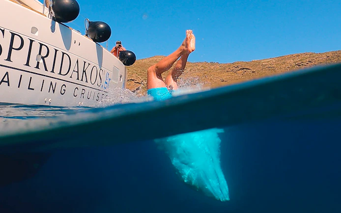 Guests diving into the sea during Santorini Joy Daytime Catamaran Cruise.