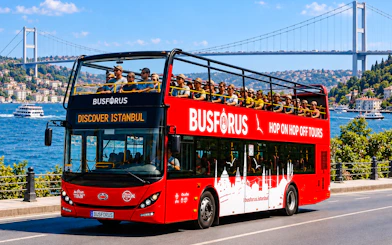 Open-top tour bus near Bosphorus Bridge in Istanbul, part of 2-day, 2-route tour.