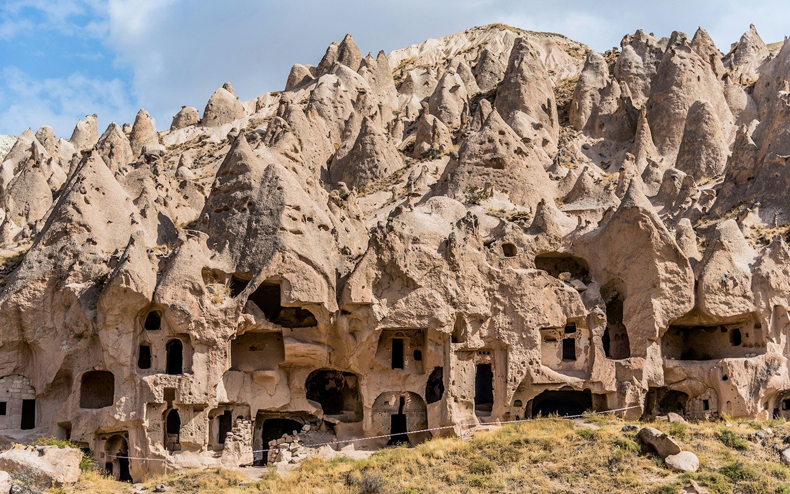Rock formations and ancient cave dwellings at Zelve Open Air Museum, Cappadocia, Turkey.