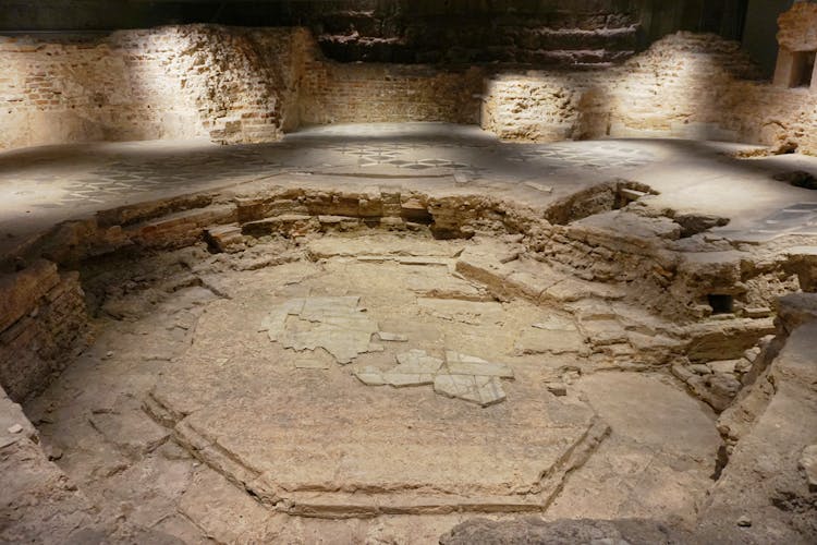 Archaeological area inside Duomo Cathedral, Milan, showcasing ancient ruins.