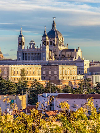 Royal Collections Gallery with Almudena Cathedral in Madrid skyline.