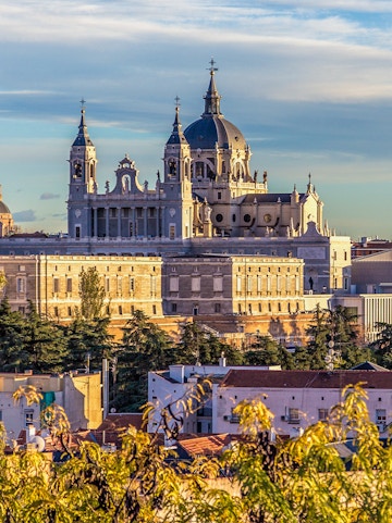Royal Collections Gallery with Almudena Cathedral in Madrid skyline.