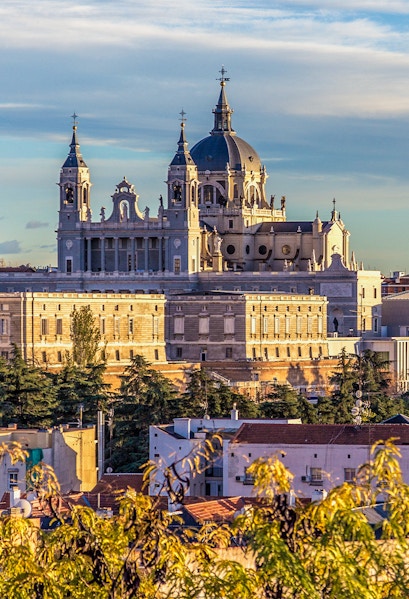 Royal Collections Gallery with Almudena Cathedral in Madrid skyline.