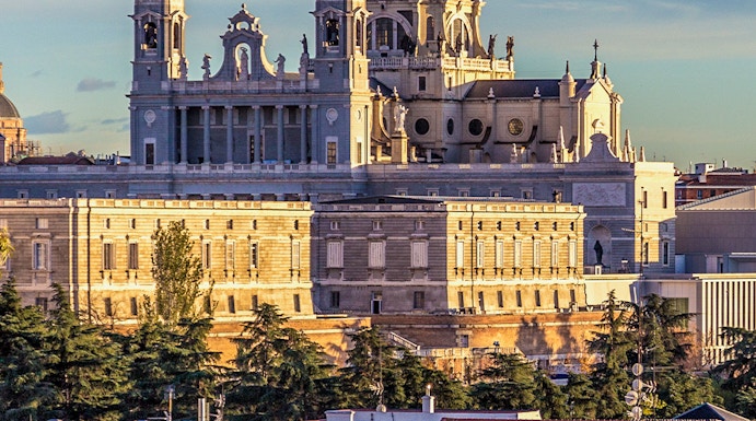 Royal Collections Gallery with Almudena Cathedral in Madrid skyline.