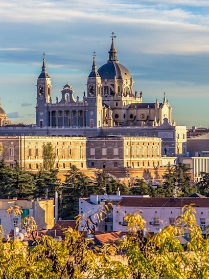 Royal Collections Gallery with Almudena Cathedral in Madrid skyline.