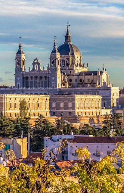 Royal Collections Gallery with Almudena Cathedral in Madrid skyline.