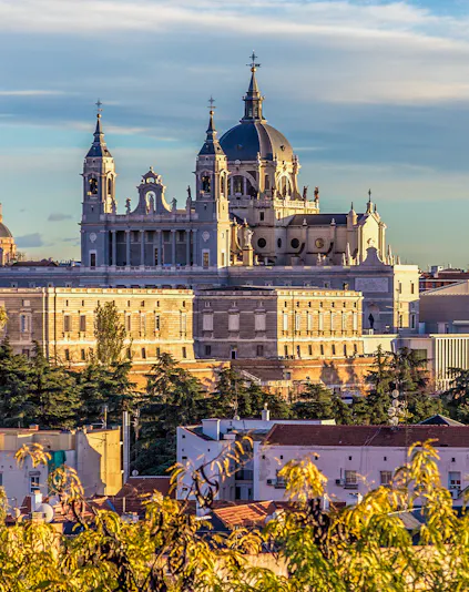 Royal Collections Gallery with Almudena Cathedral in Madrid skyline.