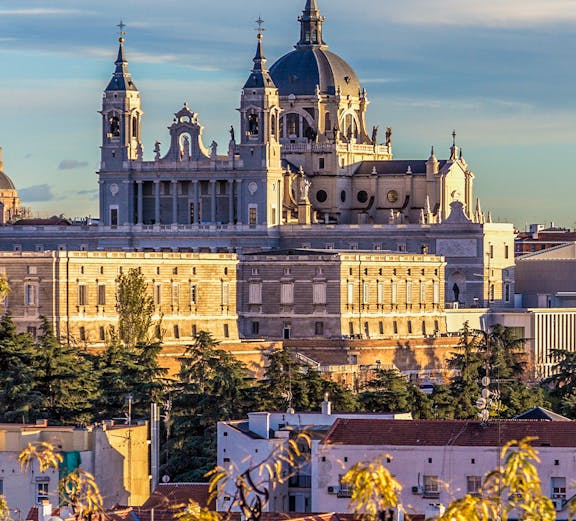 Royal Collections Gallery with Almudena Cathedral in Madrid skyline.