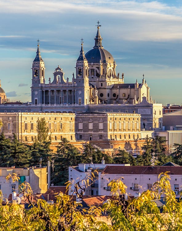 Royal Collections Gallery with Almudena Cathedral in Madrid skyline.
