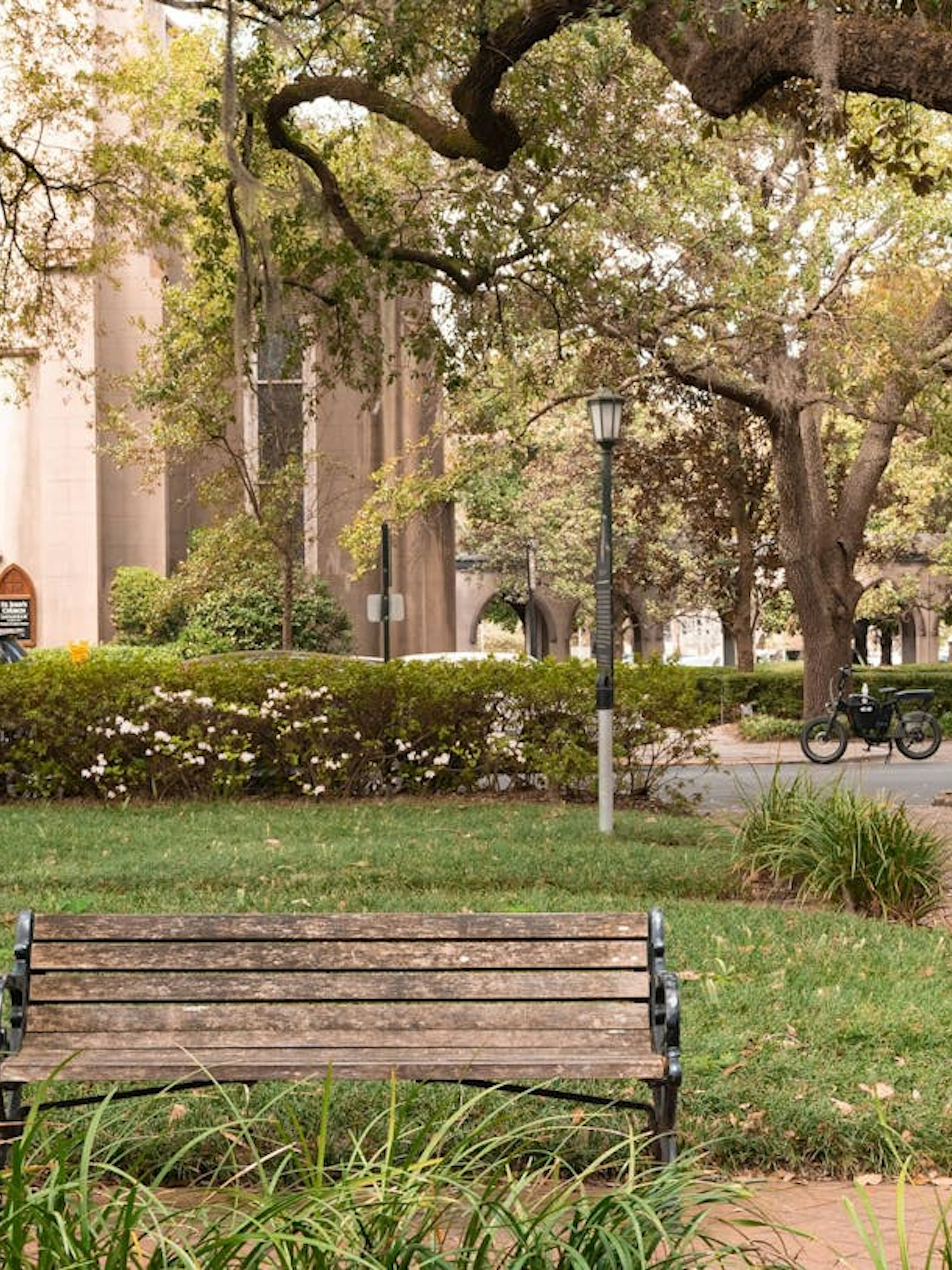 Historic church and park bench in Savannah, Georgia, part of the Ghosts of Savannah exploration game.