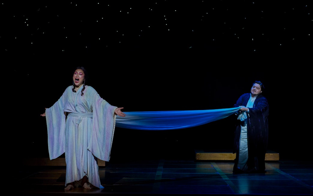 Stage performance of Madama Butterfly in Sydney with two performers in traditional costumes.