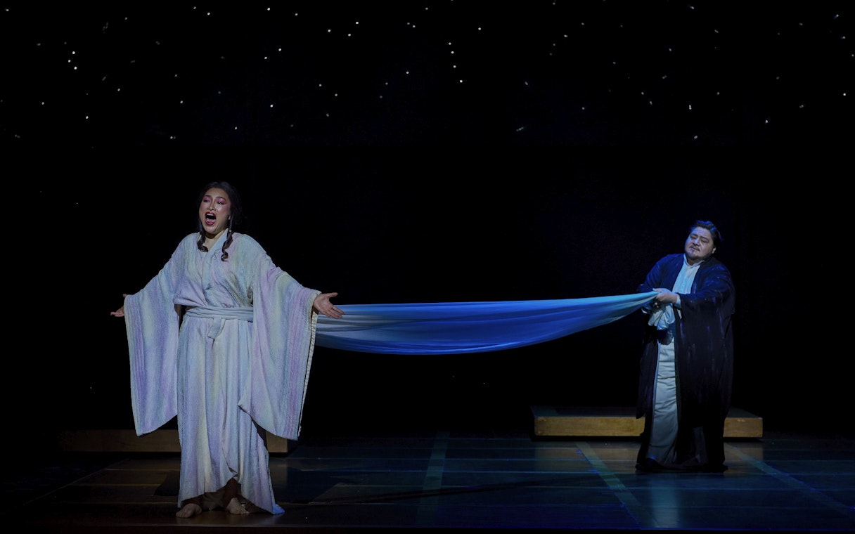 Stage performance of Madama Butterfly in Sydney with two performers in traditional costumes.