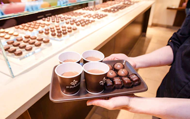 Tray with cups of hot chocolate and assorted chocolates at Pike Place Market.
