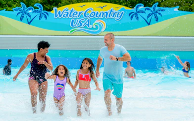 Family enjoying wave pool at Water Country USA, Busch Gardens Williamsburg.