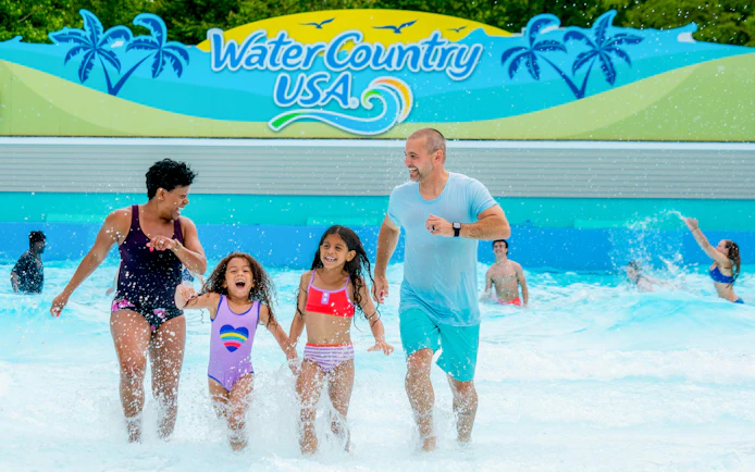 Family enjoying wave pool at Water Country USA, Busch Gardens Williamsburg.