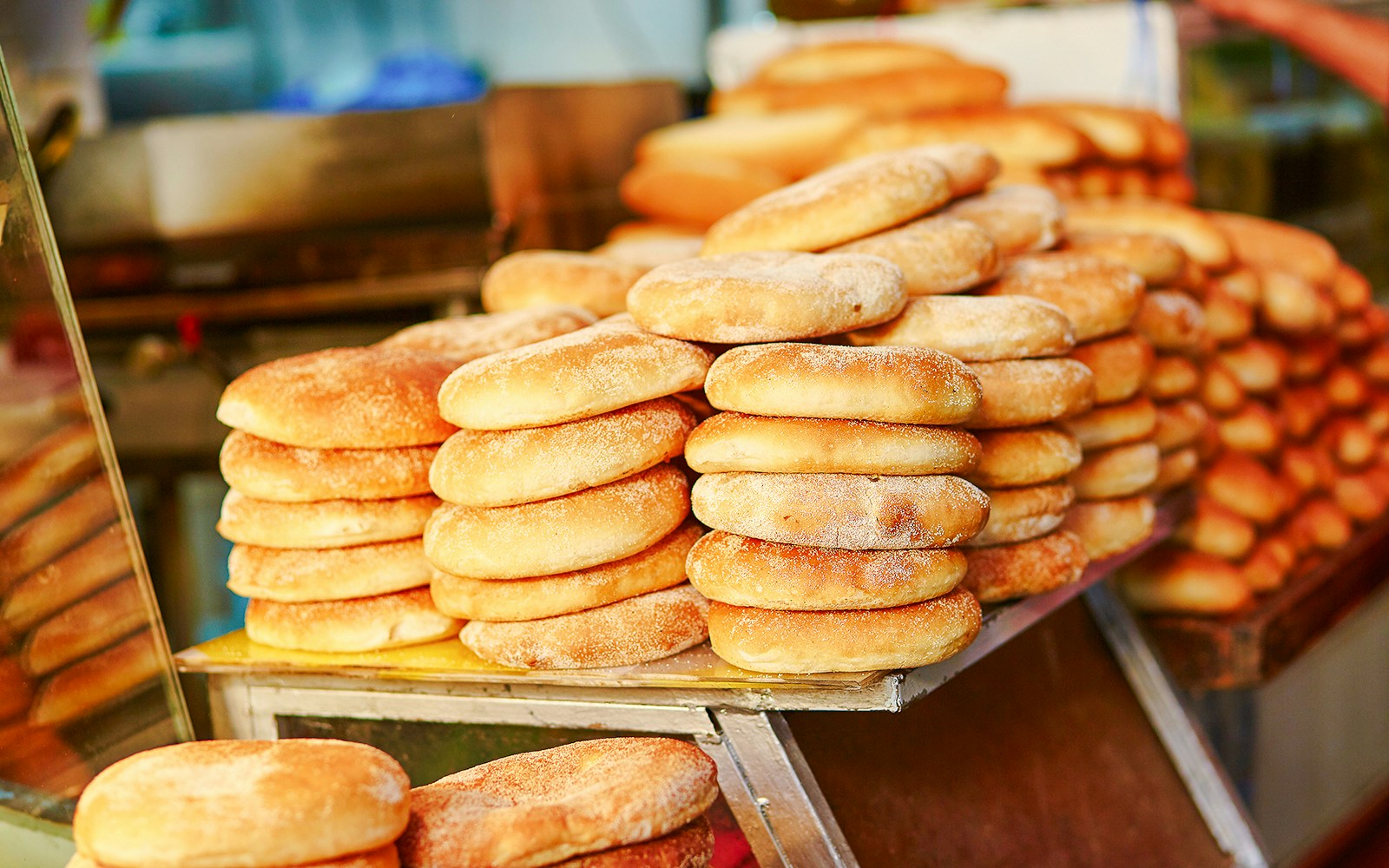 Stacks of traditional bread at a market in Marrakech, Morocco.