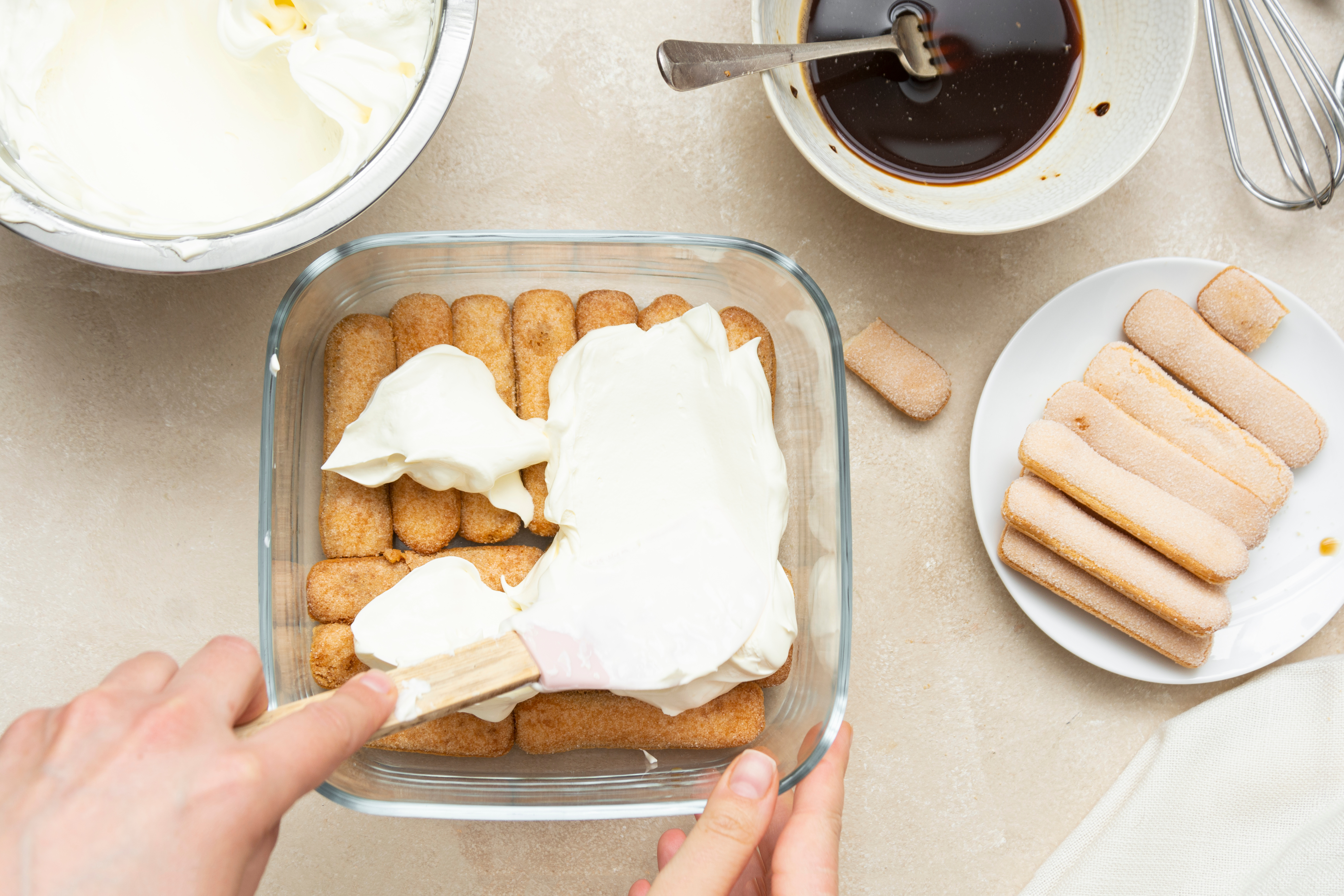 Tourists learning to make tiramisu in a Rome cooking class.